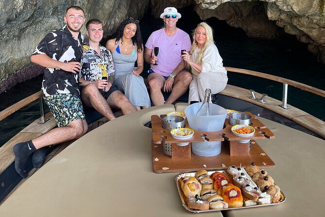 All-Inclusive Capri Boat Tour with City Visit from Positano - The coastline opener: Spiaggia Grande, Bagni di Tiberio, and Punta Carena
