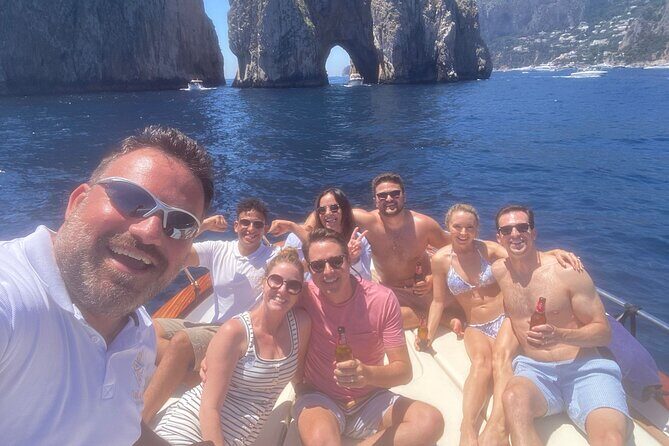 Capri and Blue Grotto Small Group Boat Tour - Punta Carena Lighthouse at sunset energy (even if you miss the true golden hour)