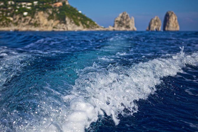 Capri Boat tour from Positano with Light Lunch, Drinks & Swim - Villa Malaparte, sea stacks, Punta Carena, and the Natural Arch