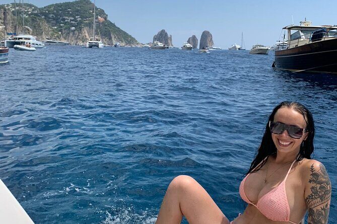 Capri Private all inclusive Boat Tour with City Exploration - Beaches and Roman-era coastline: Marina Grande, Bagni di Tiberio, and the small coves