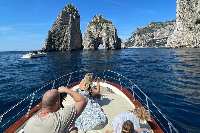 Capri Private Boat Tour from Positano or Praiano - Stop 1: I Faraglioni and the quick Love Arch pass
