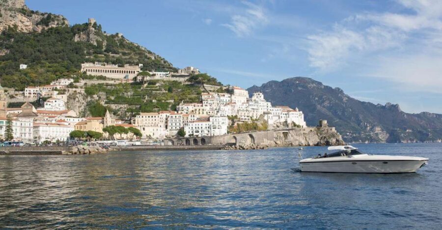 From Positano: Private Boat Tour to Capri or Amalfi - Ravello-style scenery and the Emerald Grotto swim stop (ticket not included)