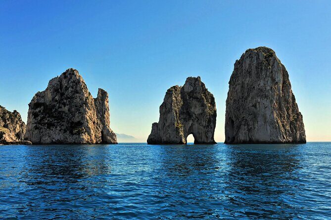 Half day to discover the fascinating island of Capri - Faraglioni passes: the iconic Capri rock formations from the water