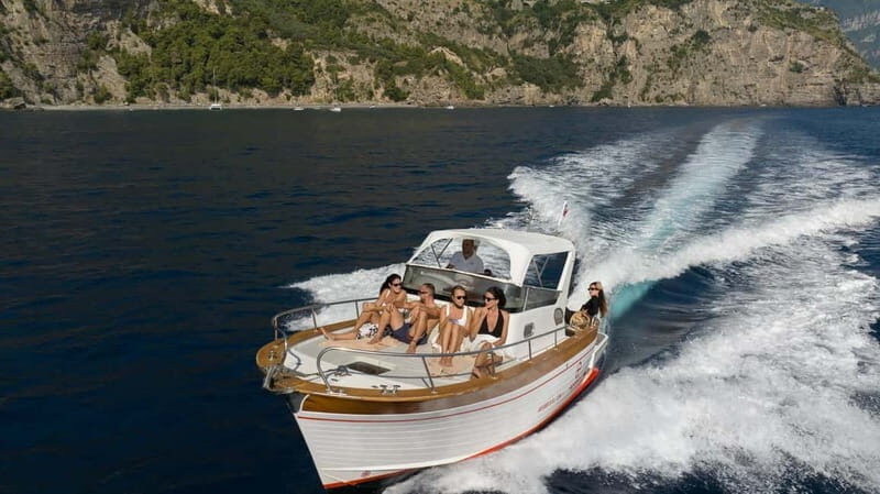 Positano: Amalfi Coast & Emerald Grotto Private Boat Tour - Snorkeling near Scoglio dell’Isca: clear water, fish, and gear included