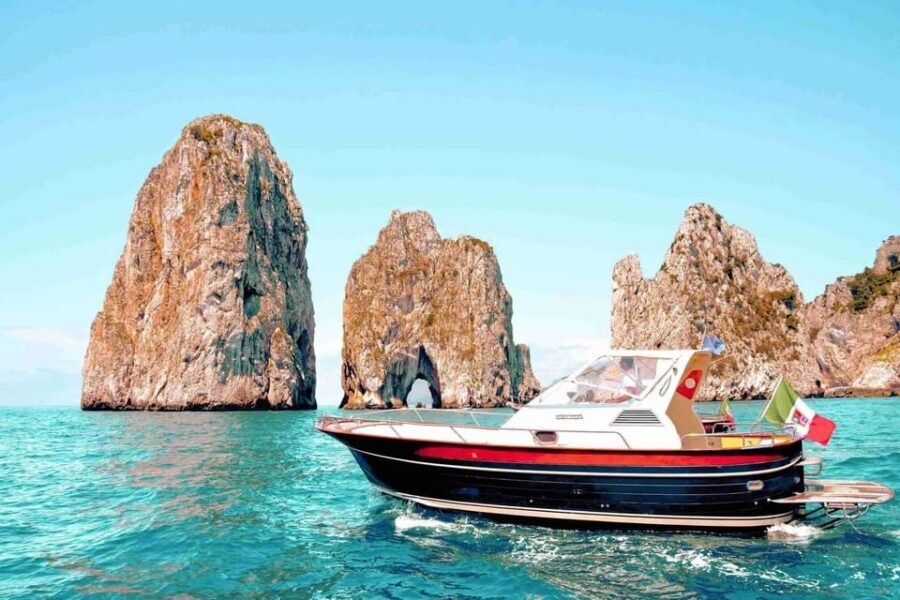 Positano: Capri and Blue Grotto Shared Boat Tour with Drinks - Amalfi Coast views and the Marciano Waterfall stop along the way