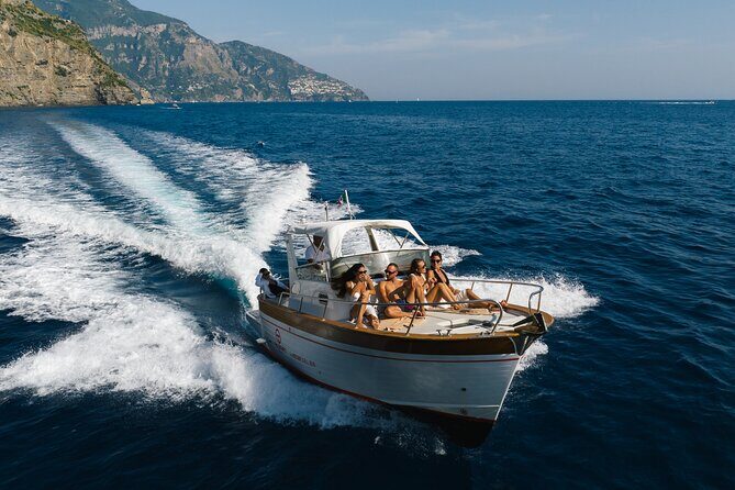 Private Ischia Boat Tour from Positano: Full Day Trip - Cartaromana Bay: sun, sea views, and Mediterranean lunch time