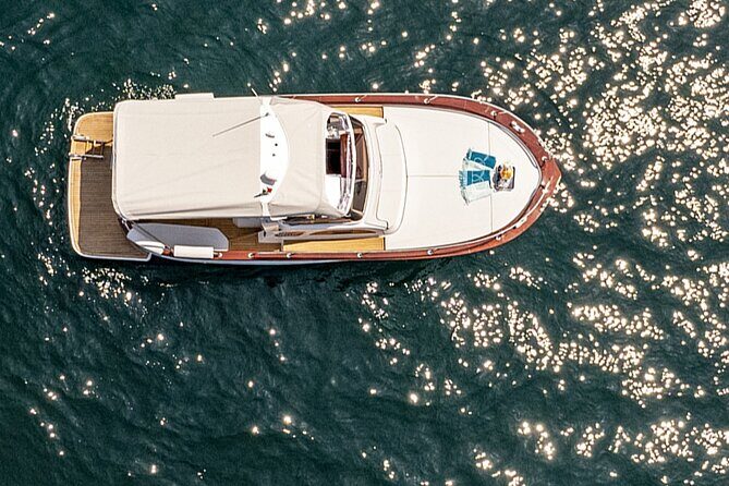 Sunset Private Boat Tour Experience in Positano - Captains Matter: Attentive Steering and Water Etiquette